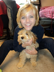 picture of oliver, an australian labradoodle therapy dog, with his family
